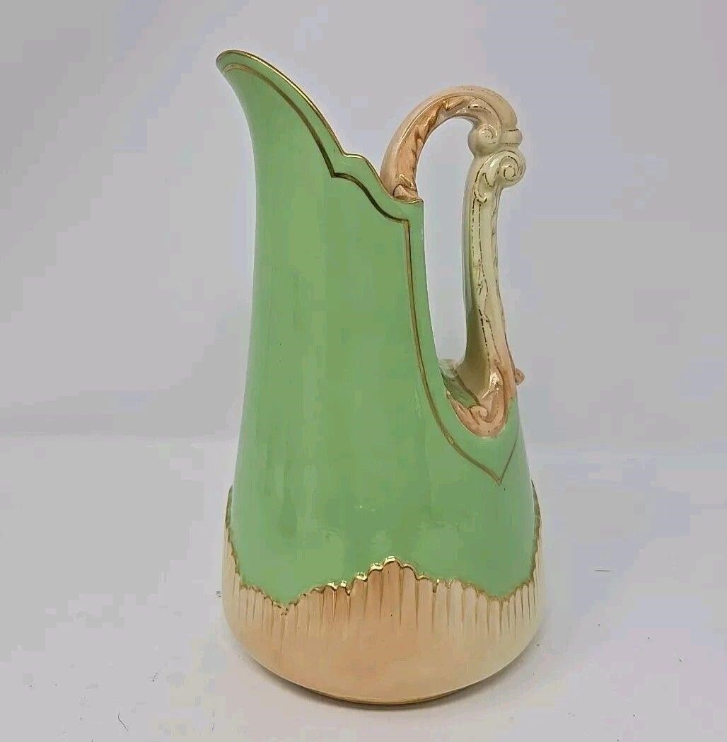 Royal Worcester Blush Ivory & Green 8" Pitcher: 1895 Royal Worcester Blush Ivory & Green 8" Pitcher / Jug #1546. There is a crack near handle as shown and a scuff on the green glaze. It measures 8 inches tall and 4 3/4 inches wide. We can offer pac