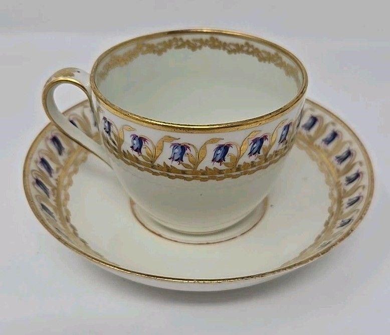Derby Cup & Saucer Pattern 157 Blue Bells: Derby tea cup and saucer. Pattern 157 with blue bells. Very good condition without chips or cracks. There is some loss to gold gilt. Circa 1782 to 1800. Approximate measurements: the cup is 2 3/8 inch