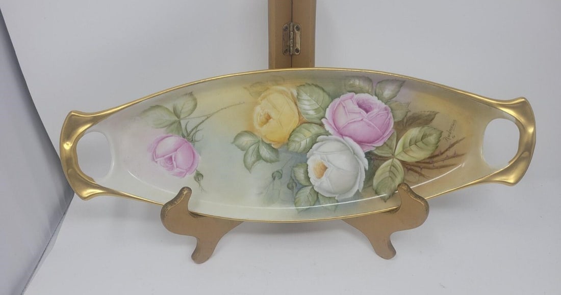Limoges France - Artist Signed Roses 15" Tray: Beautifully hand painted roses on 15 by 5 1/4 inch Limoges tray. Artist signed by Andrews, who I believe is a studio artist. No chips or damage, no scratches from use. Early 1900s.We can offer packagi