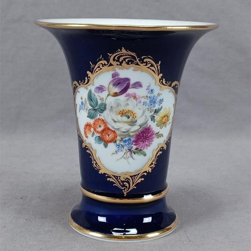 Meissen Hand Painted Floral Cobalt 5 3/8" Vase: Nice vintage German porcelain vase. Decorated with hand painted flowers in white, purple, orange, blue, pink, and yellow over white framed with gold scrollwork over a cobalt background. Gold gilding a