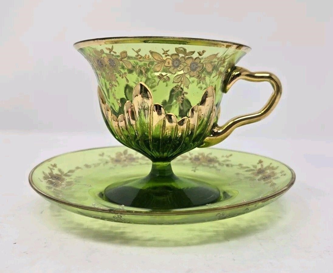 Bohemian Green Footed Glass Teacup & Saucer: Antique Bohemian Moser style green footed glass cup & saucer 19th Century. The cup is 3 1/8 inches tall, and the cup diameter is a little over 3 1/2 inches. The diameter of the saucer is 5 1/2 inches.