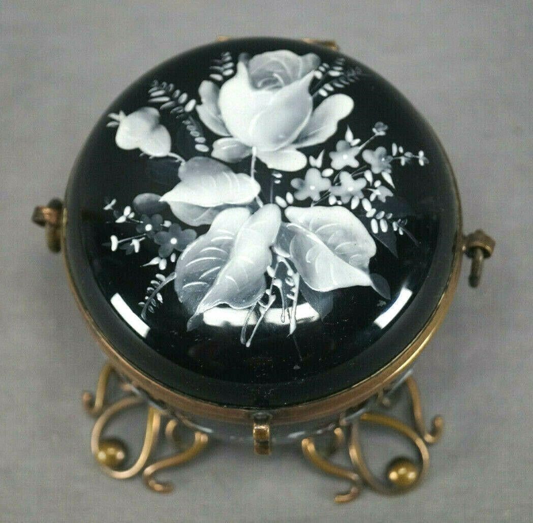 Bohemian Enameled White Rose Black Glass Brass Box: Bohemian Moser Hand Enameled White Rose Black Glass & Brass Trinket BoxNice antique Bohemian black amethyst glass trinket box with brass mounts and stand. Decorated with hand enameled white rose and f