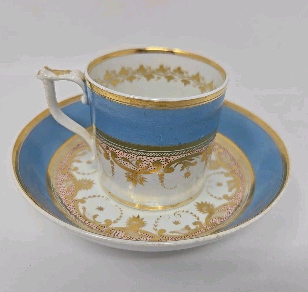 Early Derby Cup And Saucer Blue, Gold: Crown Derby Coffee can and bowl saucer set. Corn flower blue band & gold bands and scrollwork with a red dot background. Very good condition without chips or cracks. There is a manufacturer imperfecti