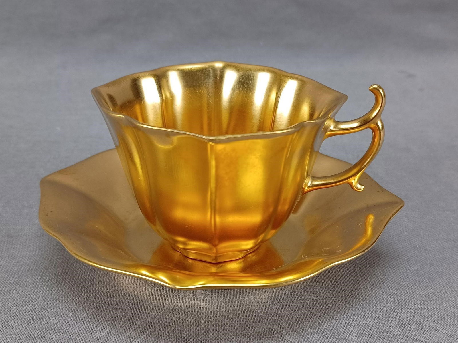 Chryso Ceramics Washington DC Tea Cup & Saucer: Nice antique porcelain tea cup and saucer. Decorated entirely in gold gilding. Has a blurry Healey Gold Trade Mark Chryso Ceramics Washington D.C. Circa 1892-1920 mark on the bottom of the saucer.Has
