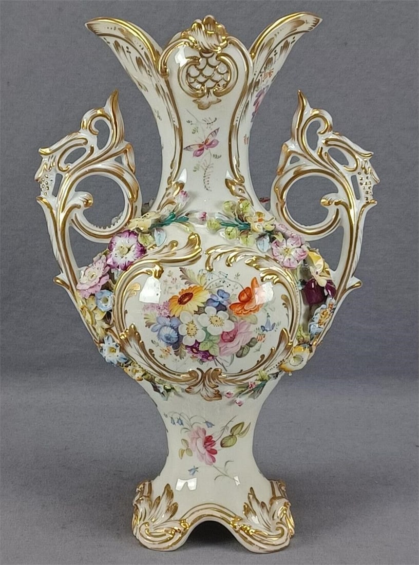 Coalport Coalbrookdale Floral Encrusted Vase C1835: Nice antique British bone china vase with relief molded and gilt highlighted Rococo scrollwork. Decorated with hand painted central flowers in pink, orange, blue, white, yellow, and purple. Has hand p