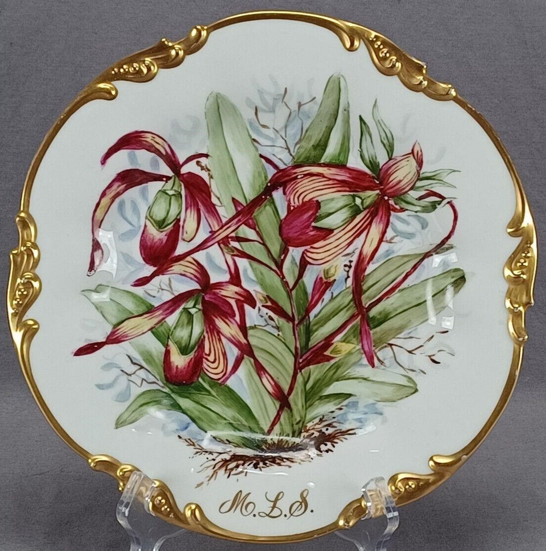 Limoges Hand Painted Purple Lily 9 5/8 Inch Plate: Nice antique French porcelain plate with relief molded and gilt highlighted scrollwork edge. Decorated with hand painted purple lily flowers. Scripted M. L. S. monogram on the bottom. Marked on the re