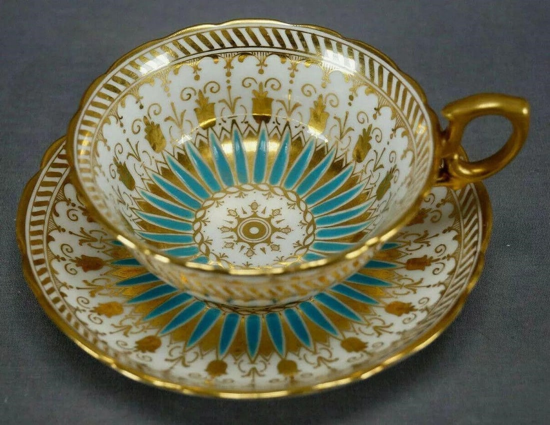 Antique Hammersley Turquoise Tea Cup & Saucer: Antique Hammersley Turquoise Enamel & Gold Tea Cup & Saucer Circa 1887-1912Nice antique bone china tea cup and saucer. The cup is decorated with turquoise enamel and gold gilt floral and scrollwork de