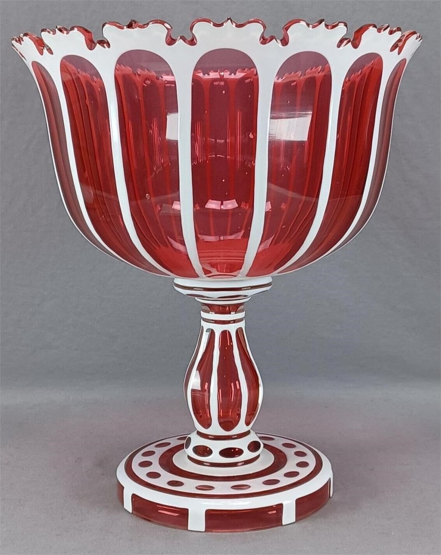 Antique Bohemian White Cranberry 11 1/2" Compote: Mid 19th century Bohemian white cut to cranberry large size compote / centerpiece bowl. With white to to cranberry panels, ovals, and roundlets. Unsigned.Has some small chips to the cutting on the rim