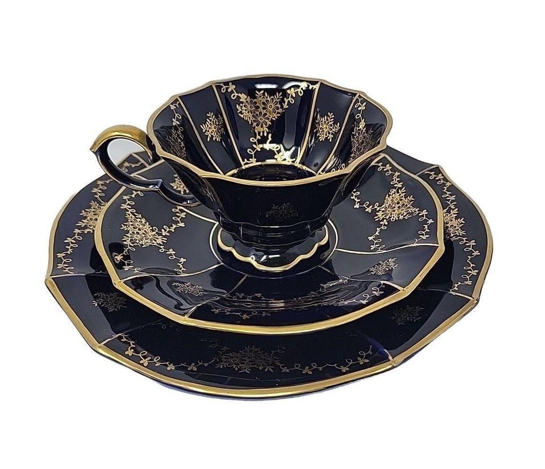 Lindner, Kueps Echt Kobalt Cup & Saucer Trio: Lindner Kueps Bavaria Kobalt Echt trio. Cobalt blue with gold floral detail Measurements: The cup is 2 1/4 inches tall and 3 3/4 inches in diameter. The saucer is 5 3/4 inches in diameter, and the pla