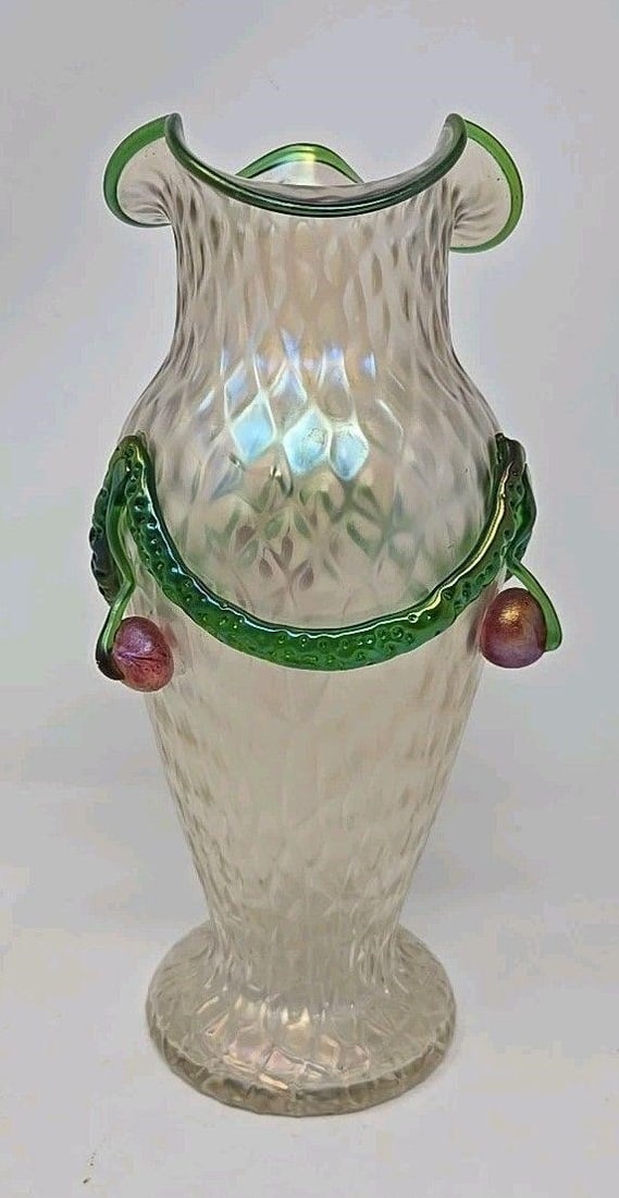 Kralik Martele Glass Vase C. 1900 Applied Cherries: Kralik Bohemian Martele vase. Light iridescence with applied cherries and green rigaree and green rim. Measures approximately 9 3 /4 inches tall and 4 1/2 inches wide. ***One of the cherries has a bro