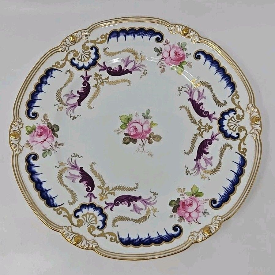 Royal Crown Derby Dinner Plate C. 1914: Royal Crown Derby Dinner Plate with pink roses and cobalt blue, purple, and gold scrollwork. Very good condition without chips or cracks. Only very minor scratches. Measures approximately 10 1/4 inche