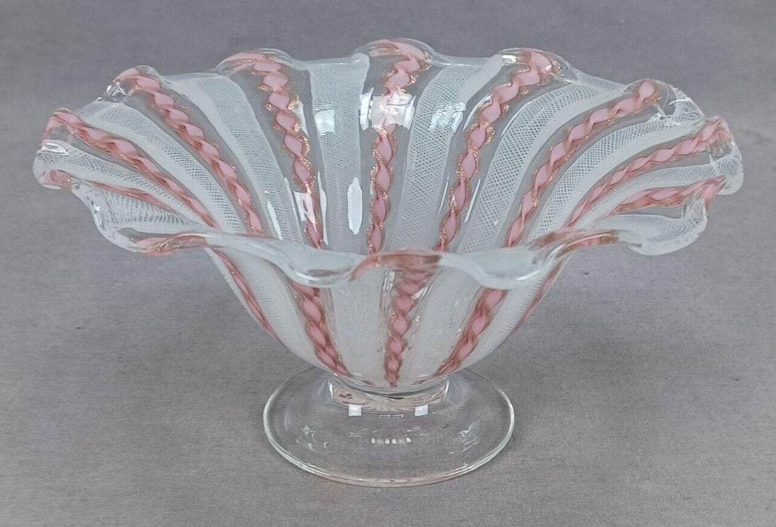 Murano Zanfirico Latticino Pink Compote B: Nice vintage hand blown pink, white, and clear Murano Zanfirico Latticino compote with ruffled rim. Has aventurine flecks in the pink. Clear foot.Good condition.Measures approximately 6 3/8 inches wid
