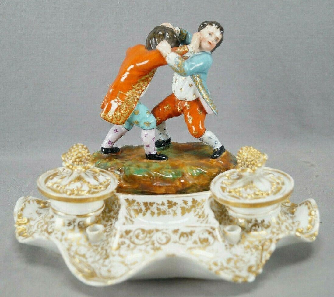 Jacob Petit Paris Figurine Rococo Inkwell Stand: Rare Old Paris / Vieux Paris porcelain Rococo style inkwell with heavy gold gilt floral scrollwork designs around the front. With relief molded leaves and acorn finial to the lids. Has a hand painted