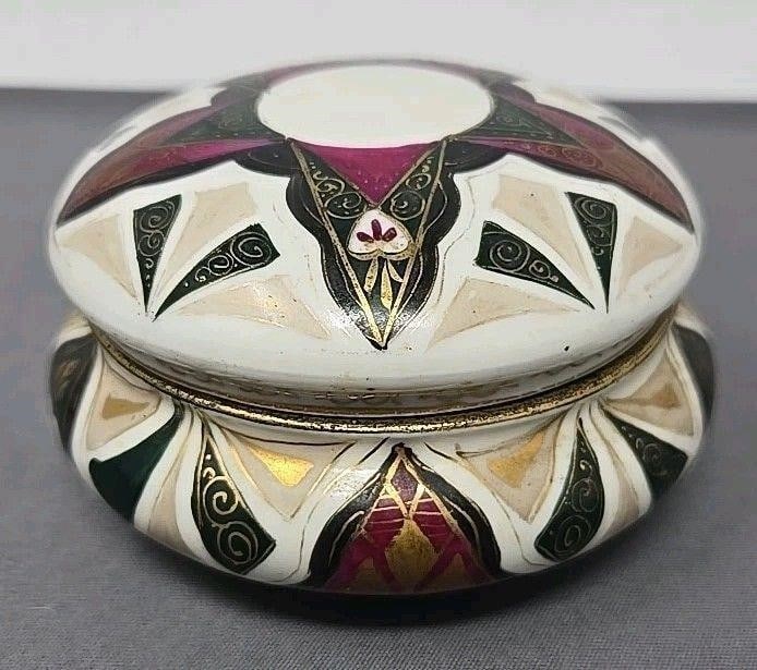 Boseck & Co Hand Painted Alhambra Box: Boseck & Co Alhambra pattern porcelain box. C. Late 1800s to early 1900s. Measures approximately 3 3/4 inches wide and 2 1/4 inches tall. Hand painted with purple, green, and gold Art Nouveau decorati