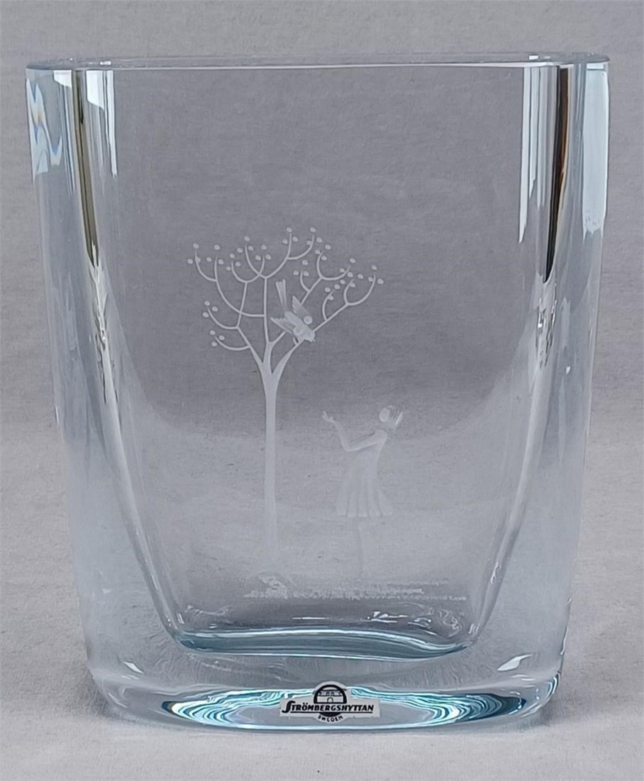 Strombergshyttan Swedish 7 3/4" Blue Glass Vase: Nice vintage Scandinavian Swedish blue glass vase. With engraved scene of a girl and a bird in a tree. Signed Strombergshyttan on the base. Strombergshyttan sticker on the front.Has a scratch on the