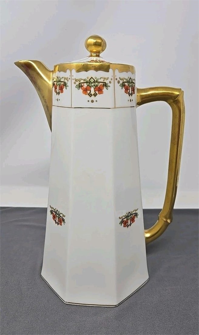 Blakeman & Henderson Chocolate Pot Original Label: Blakeman and Henderson Limoges chocolate / coffee pot from the early 1900s. Octagonal with floral design and gold gilt handle and spout. Measures approximately 10 1/2 inches tall and 5 inches wide at