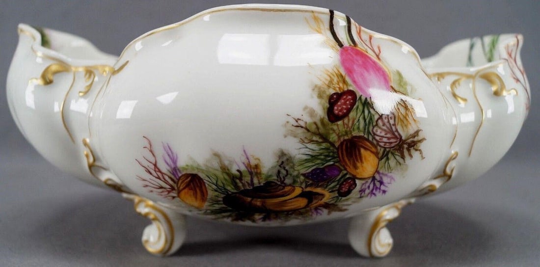 Limoges Hand Painted Sea Shells Bowl C. 1876-1889: Haviland Limoges Hand Painted Sea Shells Seaweed & Gold Footed Bowl C. 1876 - 89Antique French porcelain centerpiece bowl with relief molded scrollwork and four cabriolet style legs. Decorated with ha