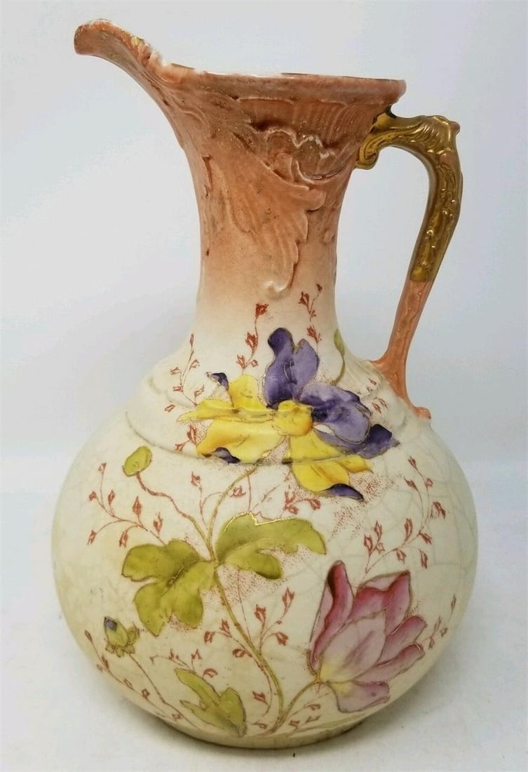 Vintage Austrian Hand Painted Pitcher Ewer Flowers: Vintage Austrian hand painted pitcher. Multicolored flowers on a blush Ivory background and a gold handle. The piece is unmarked except for an impressed mold number on the bottom. It stands 8 1/4 inch