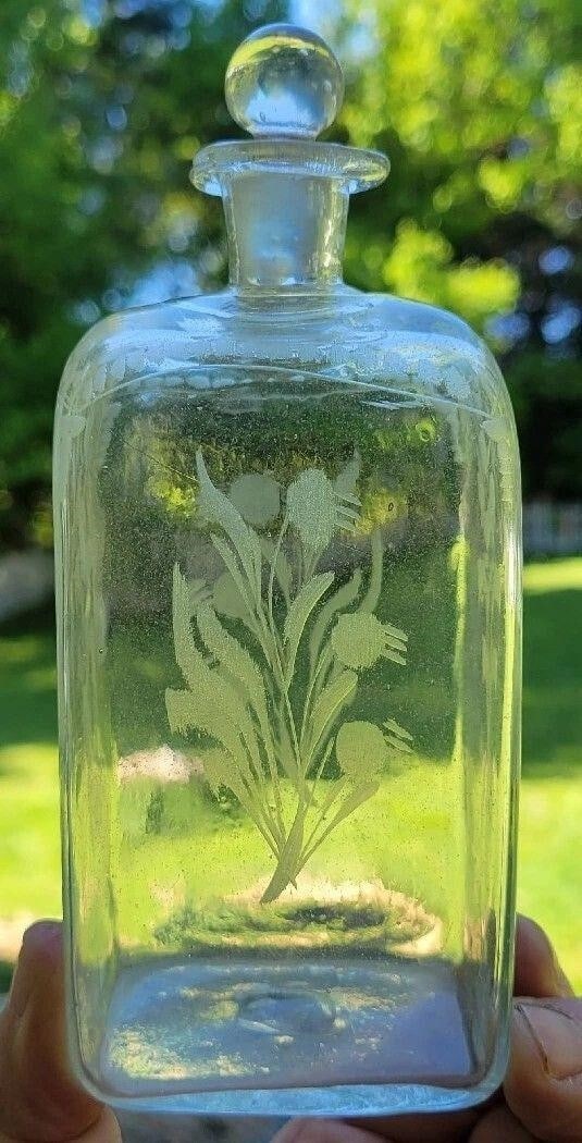 Early Pontil German Half Post Flask / Bottle: Early Pontil German Half Post Flask / Bottle with Stopper - Etch Decorated. It stands 6 1/8 inches tall and has no chips or cracks.We can offer packaging and shipping on this lot to a domestic USA add