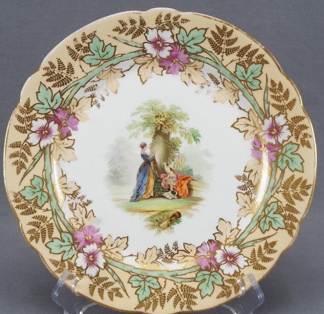 19th Century Alcock Fragonard The Souvenir Plate: Antique British bone china porcelain plate with a scalloped edge. Has a central transfer scene of Fragonard's The Souvenir, with a woman in a Georgian gown carving her lover's initials into a tree whi