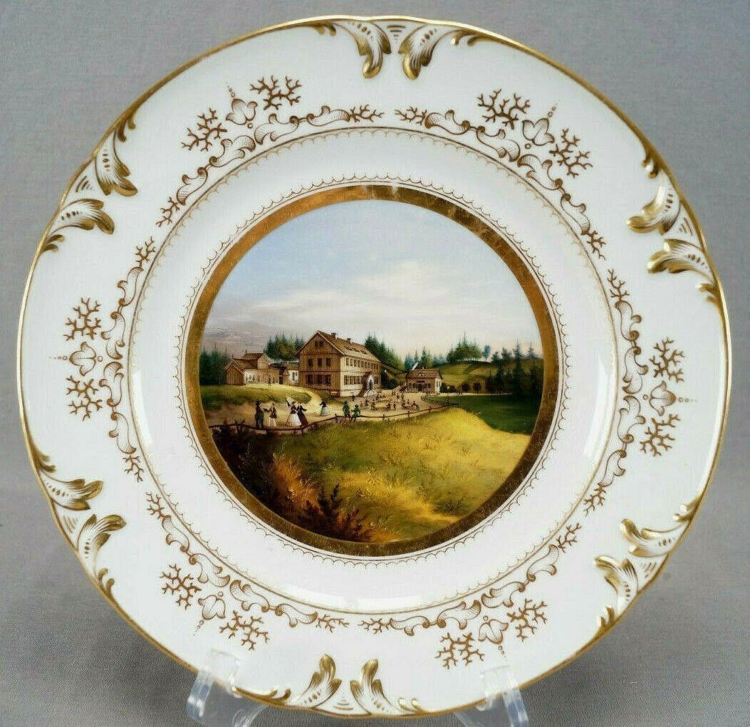 Gotha Hand Painted Schmücke Topographical Plate: Nice antique porcelain plate with relief molded and gilt highlighted scrollwork edge. Decorated in the center with a hand painted topographical landscape scene depicting the Schmücke framed in gold b