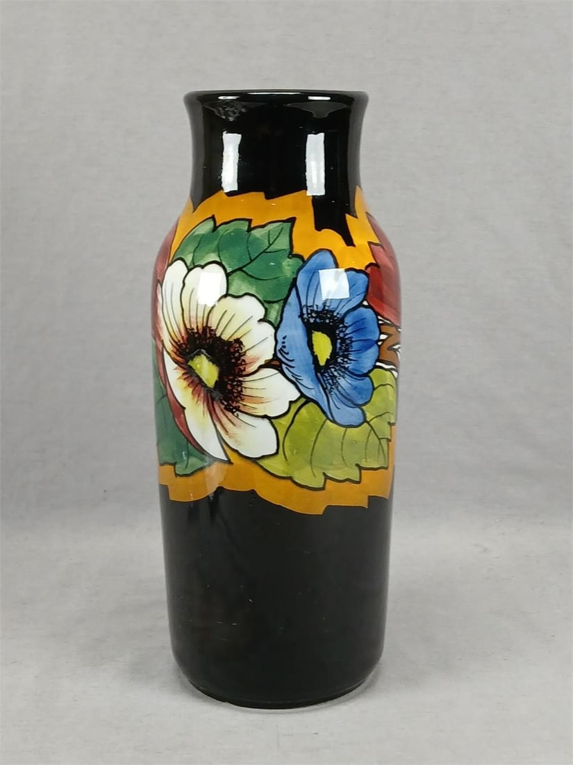 Schramberg Germany Hand Painted Art Pottery Vase: Antique German earthenware art pottery vase. Decorated with hand painted large poppy flowers in blue and white with green and burgundy leaves over an ocher and black background. Marked on the base Han