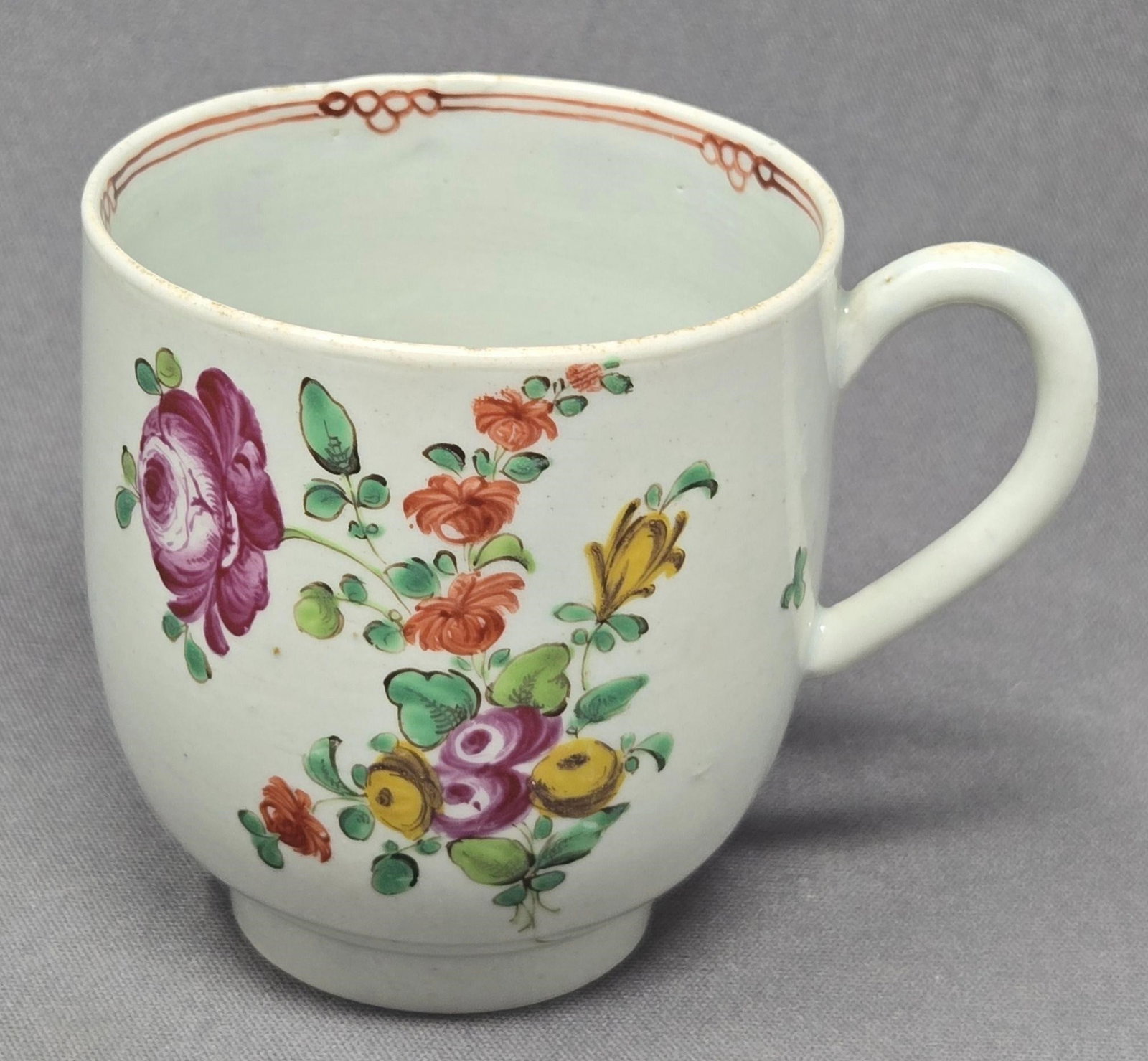 Liverpool Seth Pennington Coffee Cup C. 1770s: Liverpool Seth Pennington floral coffee cup. Late 1770s. Red design on inner rim and a loop handle. No chips or cracks. measures approximately 2 3/8 inches tall and 2 1/4 inches in diameter. We can of