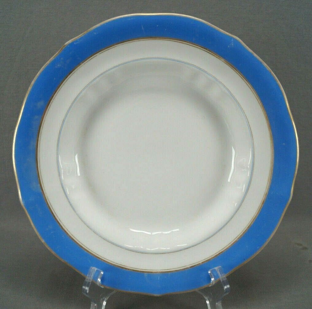 2 of FA Schumann Berlin Deep Plates C. 1835-1851: Pair of mid 19th century German porcelain deep plates / soup plates. Each plate is decorated with a blue border. With gold gilding along the edge and bottom of the blue band. Marked on the reverse FA 