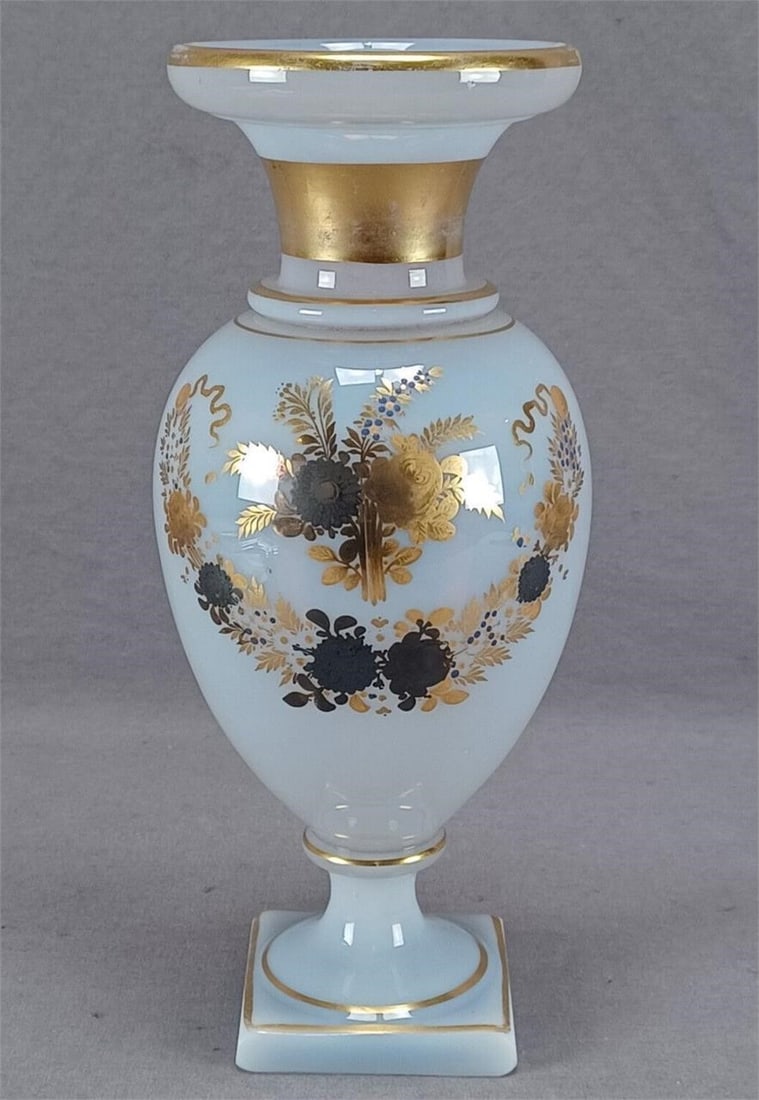 Russian Blue Gold & Metallic Opaline Urn C 1820: Antique 19th century hand blown Russian fiery opaline glass urn. Decorated with small blue hand enameled flowers with gold and metallic flowers. With gold bands around the neck, stem, and base. Ground