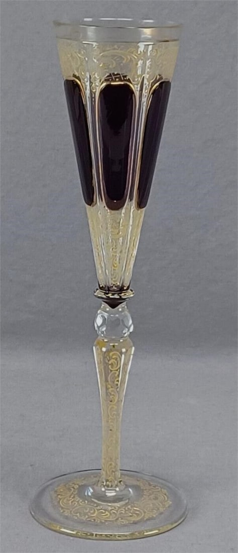 Moser Amethyst Cabochon Cut Champagne Flute: Nice antique late 19th century Moser type amethyst cabochon cut to clear crystal champagne flute. With enameled yellow scrollwork and lattice/net designs. Gold gilding along the rim. Unsigned. Of the 