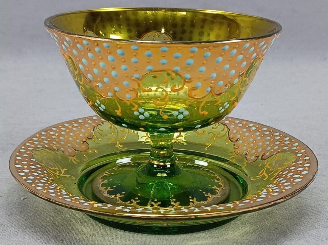 Moser Type Turquoise Jeweled Sherbet Cup & Saucer: Nice antique Bohemian green glass sherbet cup and saucer. Decorated with turquoise jewels over heavy gold and yellow floral scrollwork. Unsigned. Probably produced by Moser, Harrach or one of their co