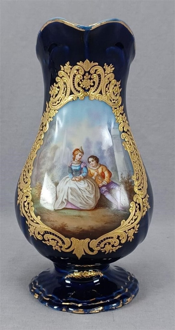 French Sevres Style Watteau Gold Cobalt Pitcher: Nice antique late 19th or early 20th century French porcelain pitcher / jug. With hand painted Watteau courting couple signed below the spout. The scene is signed Watteau and framed with elaborate