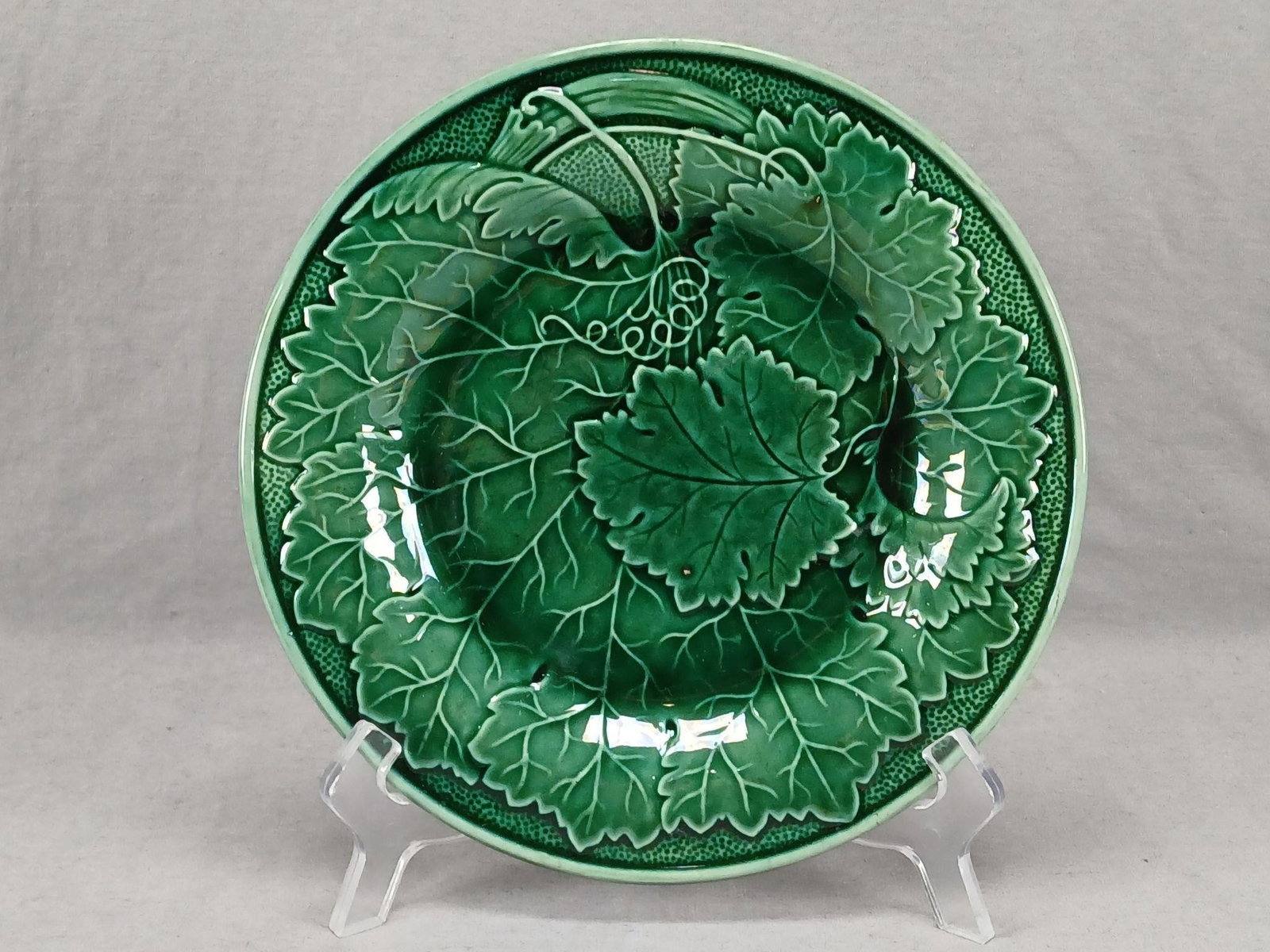 19th Century British Majolica Vine Leaf Plate: Antique late 19th century British green majolica plate with relief molded vine leaf pattern. Unmarked.Has crazing typical of earthenware, and some wear consistent with age and use, but otherwise good 