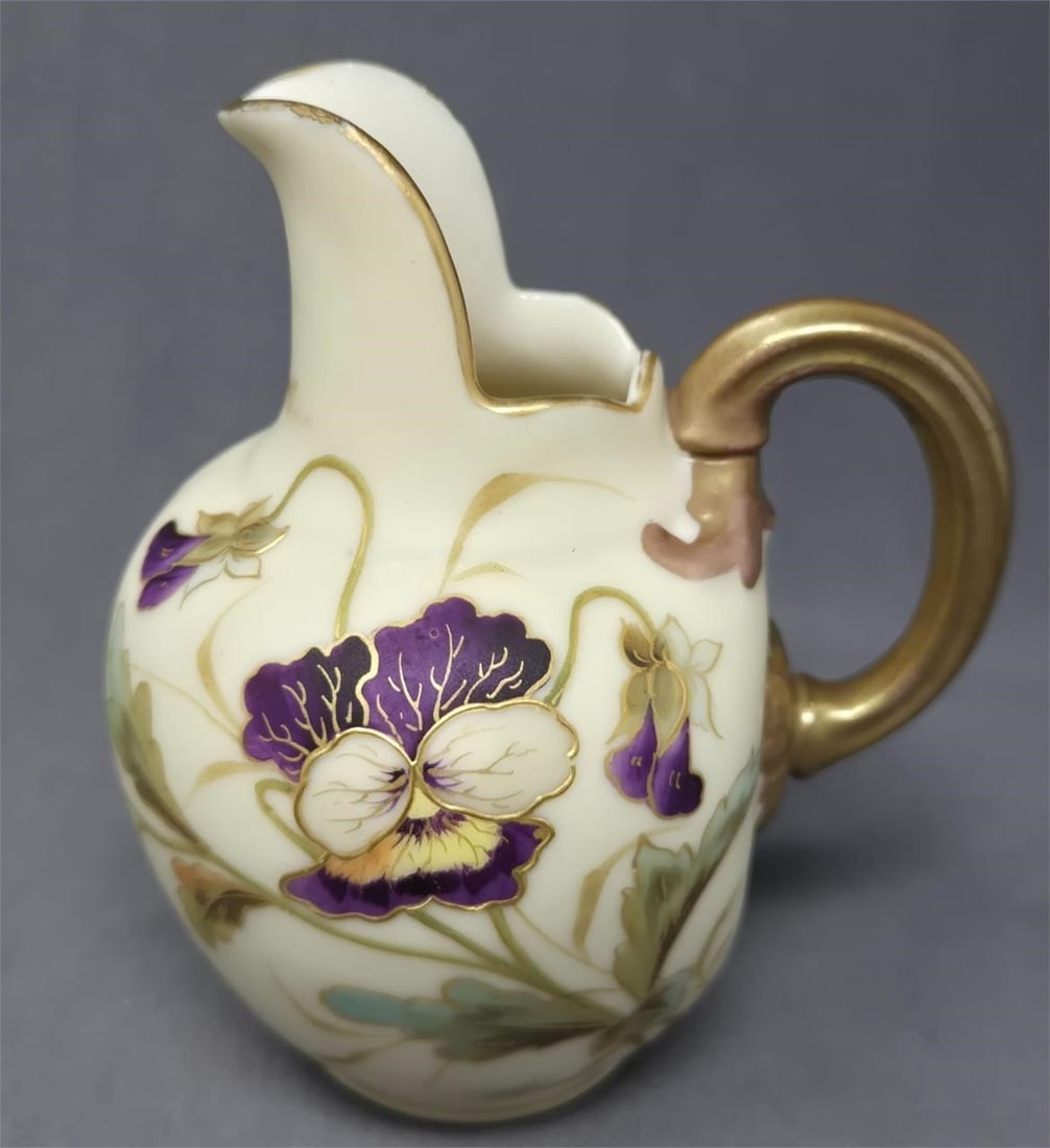 Carlsbad Blush Ivory Pansies Small Jug 4 3/4": Bohemian Carlsbad blush ivory small jug with pansy flowers. No chips or cracks, there is some loss to gold gilt. Measures approximately 4 3/4 inches tall and 4 inches wide with handle. Circa 1890. We 