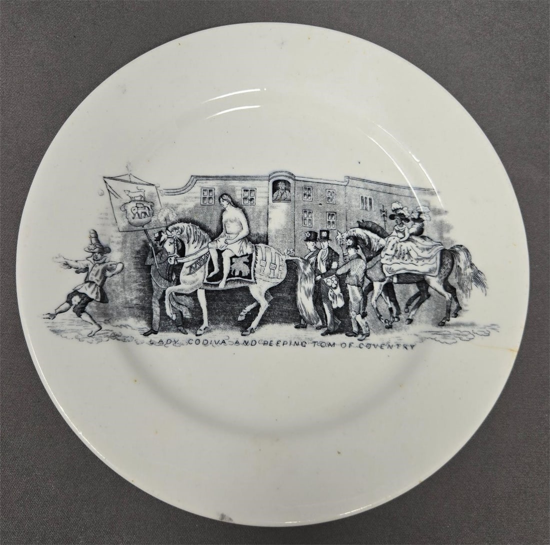 Lady Godiva & Peeping Tom of Coventry Plate 1860s: Black transferware plate of Lady Godiva and Peeping Tom of Coventry porcelain plate. Unknown maker, circa 1860s. Source print is from the "History of Coventry" published in 1852. There is a crack as