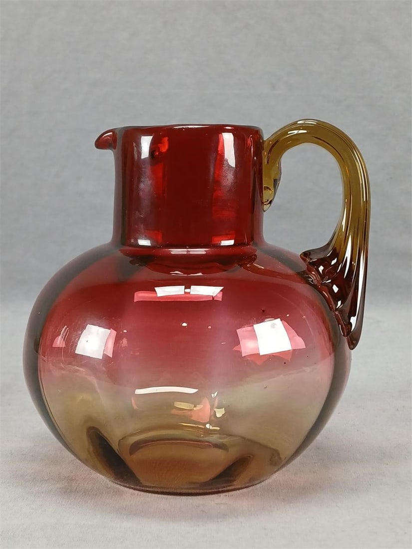 Antique New England Glass Amberina Pitcher: Antique late 19th century blown optic molded Amberina glass pitcher with applied reeded handle. Ground and polished pontiled base. Unsigned. Probably produced by New England Glass. Circa 1880s. Good c