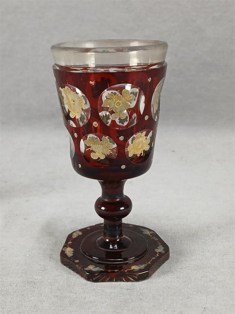 Bohemian Ruby Flashed Gilt Floral Wine Glass A: Mid 19th century Bohemian Biedermeier period blown clear wine glass with cut roundlets to the bowl and cut rim. Ruby flashed with gold and white small dots and gold and white enameled flowers in the r