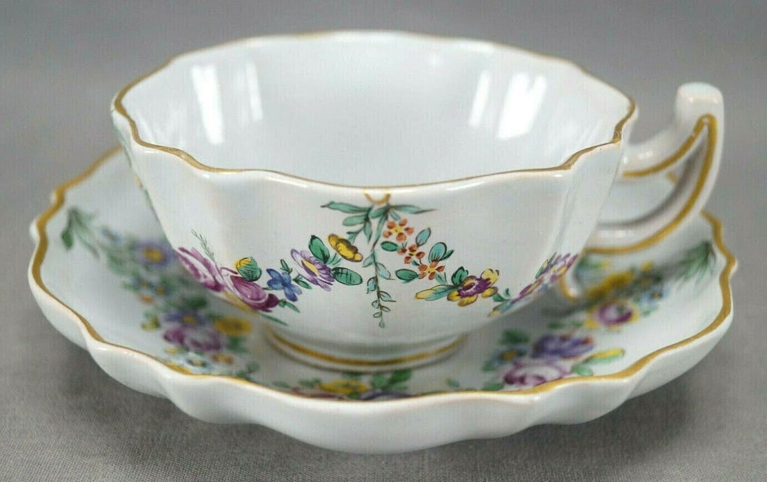 Samson Sceaux Style Hand Painted Tea Cup & Saucer: Nice mid to late 19th century faience cup and saucer. Decorated with hand painted pink rose, purple, blue, and yellow floral swags. Gold gilding along the edge. Has a pseudo / spurious Sceaux mark on 