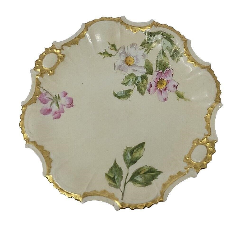 Limoges France Blush Ivory & Gold 9 1/2" Plate: Tressemann & Vogt Limoges Coiffe blank plate. Circa 1891 to 1914. Blush ivory with wild roses and heavy gold border. Measures approximately 9 1/2 inches diameter. No chips or cracks or visible scratch