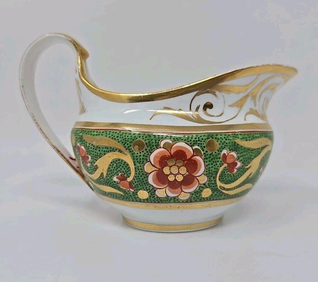 Derby Creamer, Green Band With Orange 1806-25: Derby porcelain creamer with a hand painted green speckled band, orange flowers, and gold scrollwork. Circa 1806 to 1825. No chips or cracks. There is some loss of gold, as shown. Measures approximate