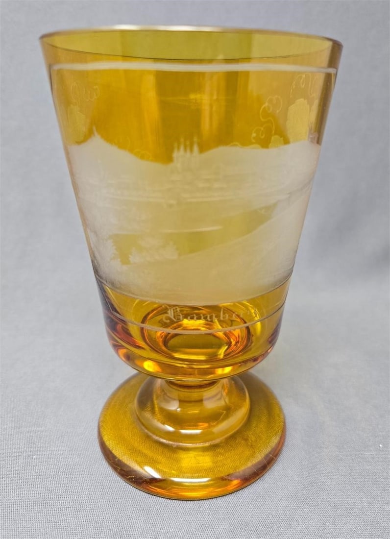 Bamberg Spa Glass Amber Flashed Circa C. 1840s: Amber flashed spa glass with an intricate etching of Bamberg Germany and grape leaves. No chips or cracks, honest wear on base. circa 1840s.Measures approximately 5 inches tall and 3 inches in