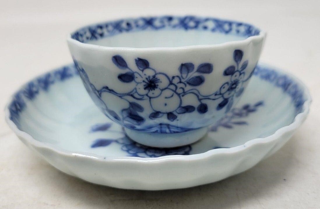 Chinese Export Tea Bowl Cup & Saucer c1730-1750: Chinese Export Handleless Tea Bowl Cup & Saucer c. 1730 - 1750. Blue floral decorations. The cup stands 1 3/4 inches high and the saucer is 4 5/8 inches across. The saucer is perfect except for some c