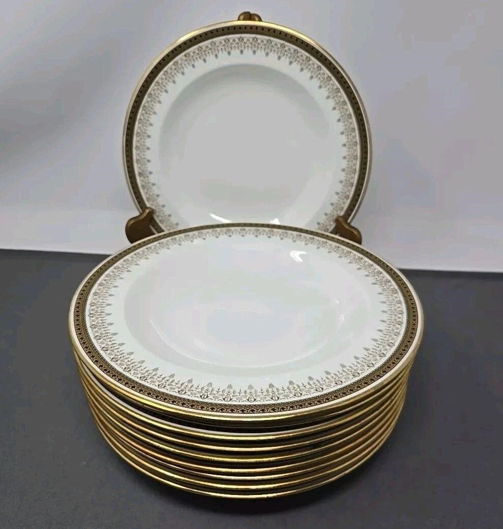 10 Cauldon China England Rimmed Soup Bowls: Set of 10 Cauldon rimmed soup bowls. Have a gold and black border. Measures approximately 1 1/4 inches tall and 9 3/8 inches diameter. They have scratches from use and stacking, otherwise very good co