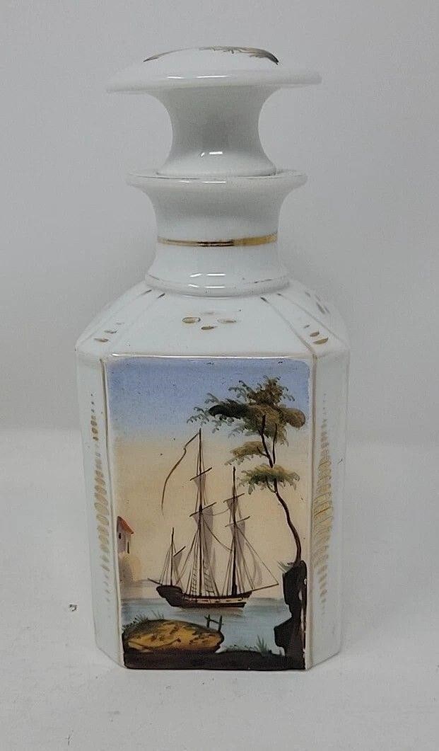 Old Paris Hand Painted Cologne Perfume Bottle: Old Paris Porcelain cologne or perfume bottle from 1840. There is a ship / sailboat on one side and a house on water on the other. There are floral decorations on the other two sides. There is a 1/2 i