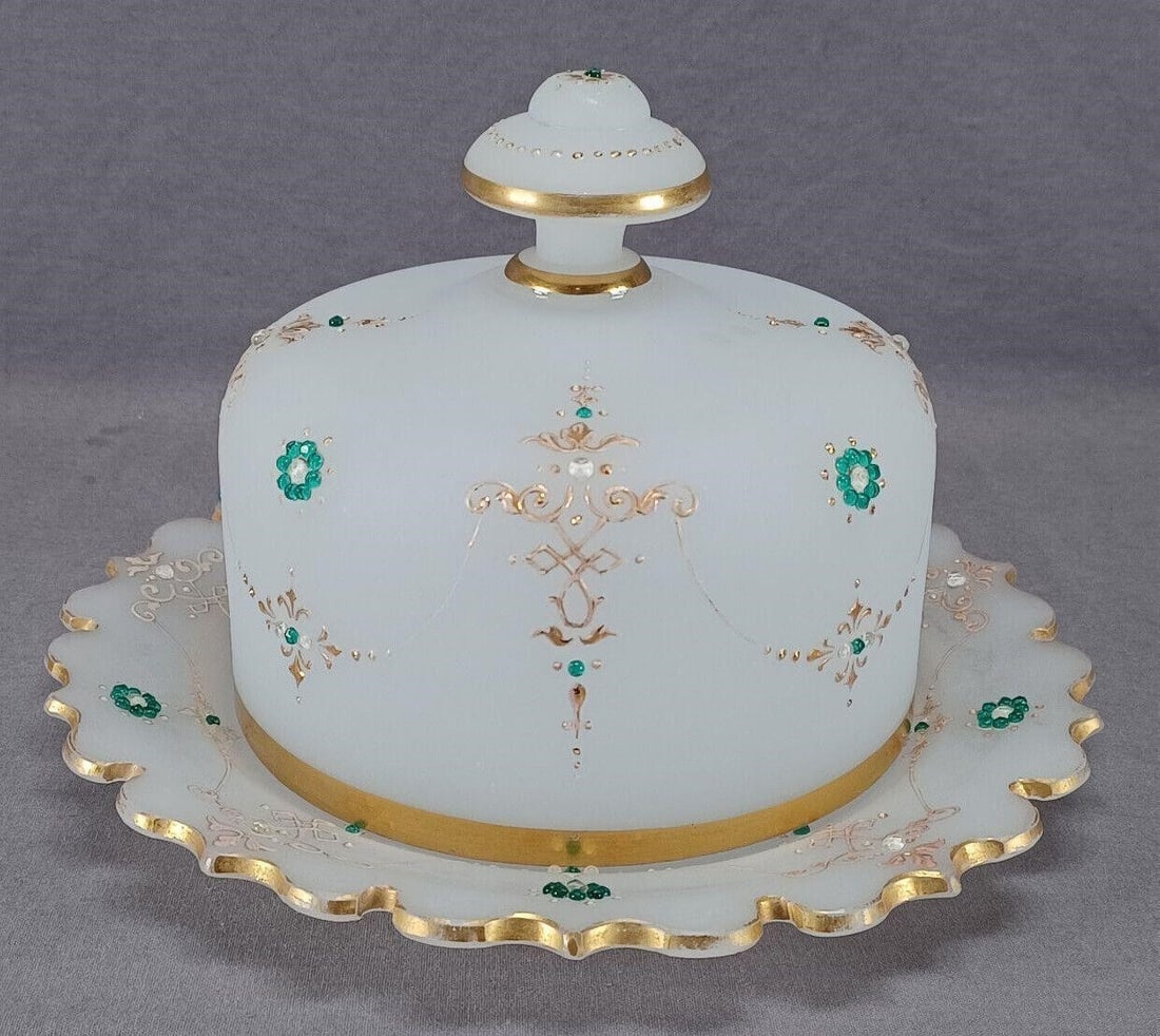 Josephinenhutte Jeweled Glass Cheese Dome: Nice antique Bohemian white alabaster glass cheese dome. Decorated with hand enameled gold and white floral scrollwork with applied clear and green jewelling and gold and gold enamel beading. Has gold