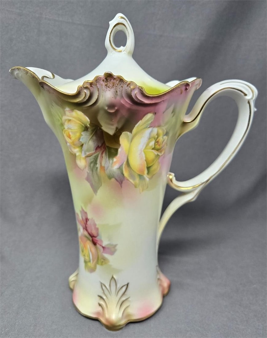 RS Prussia Chocolate Pot Mold 646 Yellow Roses 9": RS Prussia chocolate pot in mold 646. It has yellow roses with gold highlighted molded details. Measures approximately 9 inches tall and 7 1/4 inches from spout to handle and 4 1/4 inches wide. Very g
