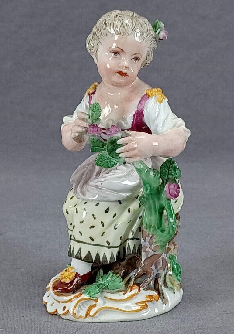 Meissen Marcolini Lady With Roses Figurine: Nice antique 18th century / early 19th century Marcolini period Meissen German hand painted porcelain figurine of a lady with a rose bush. Marked on the back of the base with the blue crossed swords m