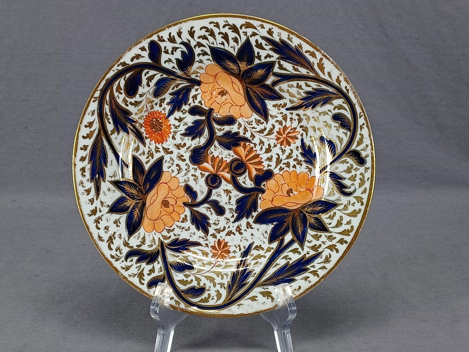 Grainger Worcester Imari Japan Pattern 8" Plate D: Nice antique British bone china plate. Decorated in an Imari / Japan type pattern with hand painted orange, cobalt, and gold floral design. Gold gilding along the edge. Unmarked. Attributed to Grainge