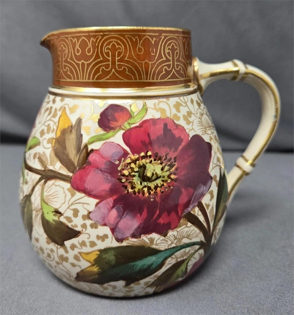 Doulton Burslem Floral Decorated Earthenware Jug: Doulton Burslem earthenware jug with floral decoration and gold highlights. It was made at the Nile Street factory around 1885. It stands 4 inches tall and is approximately 3 3/4 inches in diameter at
