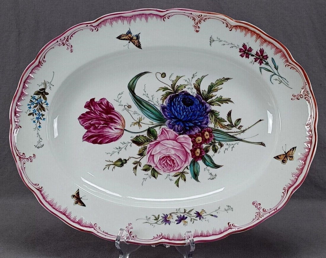 KPM Berlin Floral Butterflies 15 3/4" Platter 1840: Nice antique mid 19th century German porcelain platter. Decorated with a hand painted floral bouquet in the center with large pink rose, pink tulip,and purple and blue flowers. Has a pink / puce scrol